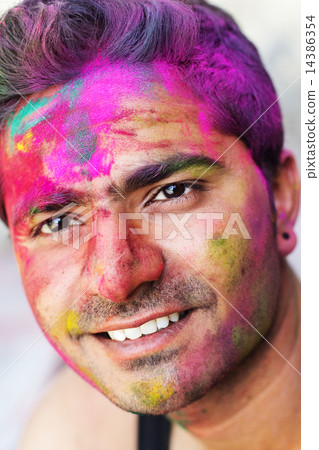 Portrait of Indian guy with colorful paint on face Portrait of Indian guy with colorful paint on face 14386354