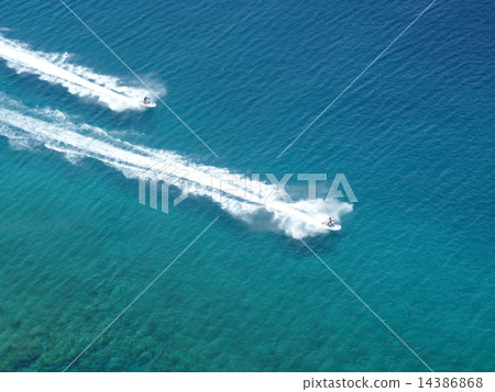 Jet ski white waves shine in the blue waters of Guam 14386868