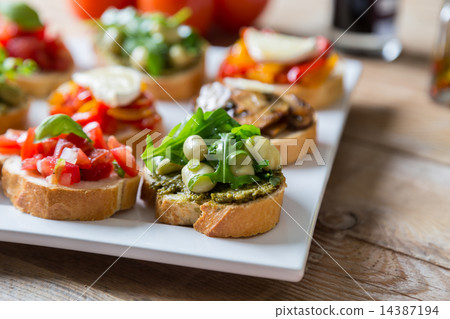 Bruschetta with beans and arugula, mushrooms 14387194