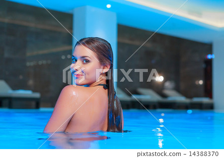 Beautiful woman in luxury swimming pool Beautiful woman in luxury swimming pool 14388370