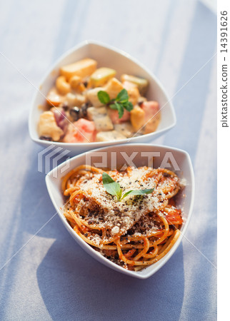 White bowl of fresh fruit salad and spaghetti White bowl of fresh fruit salad and spaghetti 14391626