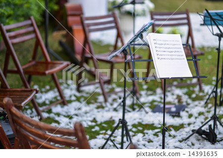 Music stand and empty chairs in the garden Music stand and empty chairs in the garden 14391635