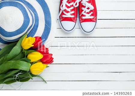 Bouquet of tulips and gumshoes with blue hat Bouquet of tulips and gumshoes with blue hat 14393263
