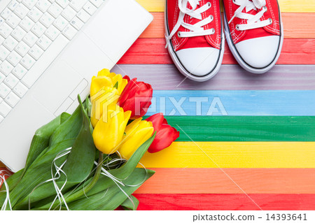 White computer and bouquet of tulips with gumshoes 14393641