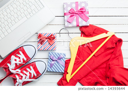 White computer and gumshoes with clothes White computer and gumshoes with clothes 14393644