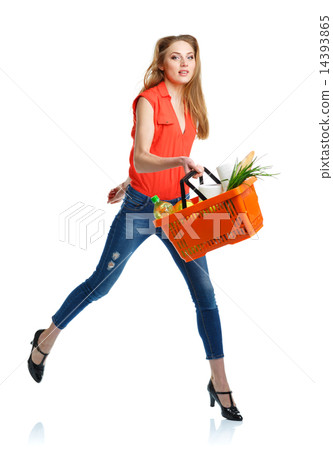Woman with assorted grocery products in basket Woman with assorted grocery products in basket 14393865