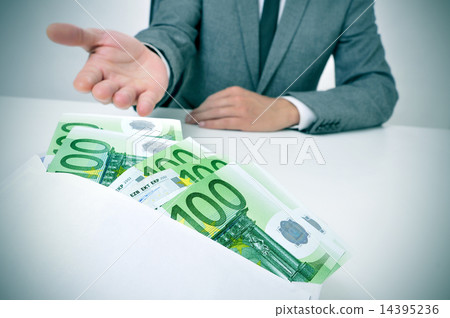 man taking an envelope full of euro bills 14395236