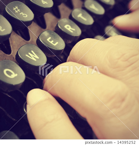 typing on an old typewriter, with a retro effect 14395252