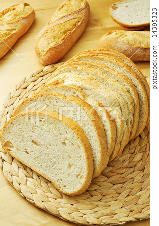slices of pan de payes, a round bread typical of Catalonia, Spai slices of pan de payes, a round bread typical of Catalonia, Spai 14395323
