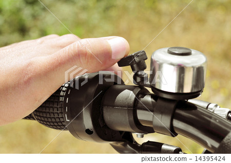 man ringing a bicycle bell man ringing a bicycle bell 14395424