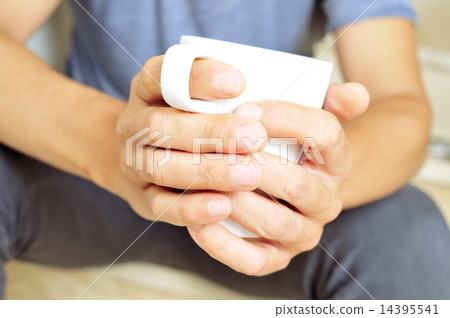 young man with a cup of coffee young man with a cup of coffee 14395541