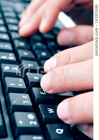typing on a computer keyboard typing on a computer keyboard 14395846