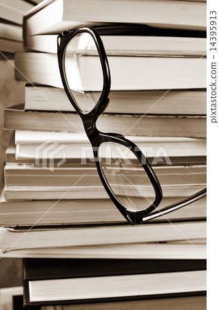books and eyeglasses, in black and white books and eyeglasses, in black and white 14395913