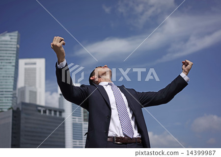 Caucasian man raising his arms to celebration 14399987