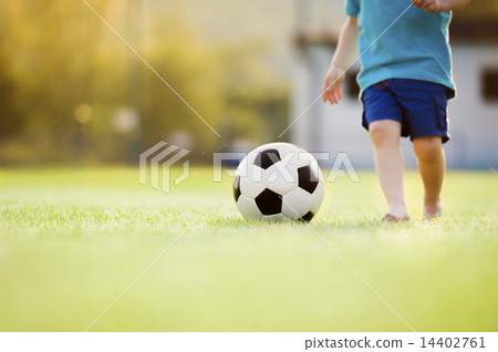 Little boy playing football 14402761