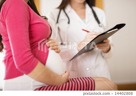 Pregnant woman with doctor Pregnant woman with doctor 14402808