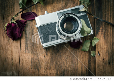 Old retro camera on vintage wooden boards Old retro camera on vintage wooden boards 14403078