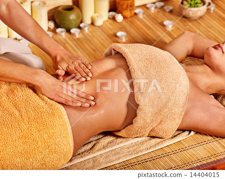 Woman getting massage in bamboo spa. 14404015