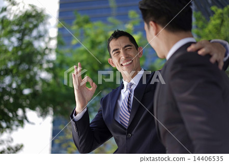 Multi-Racial co-workers in team work collaboration 14406535