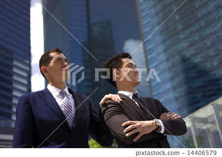 Multi-Racial co-workers in team work collaboration 14406579