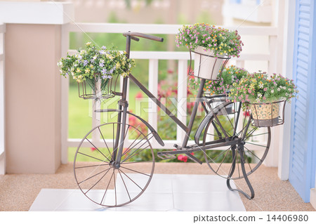 Fake flowers in the vase on a bicycle Fake flowers in the vase on a bicycle 14406980