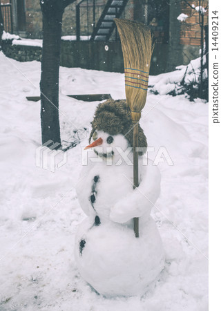 Snowman in the yard 14409214