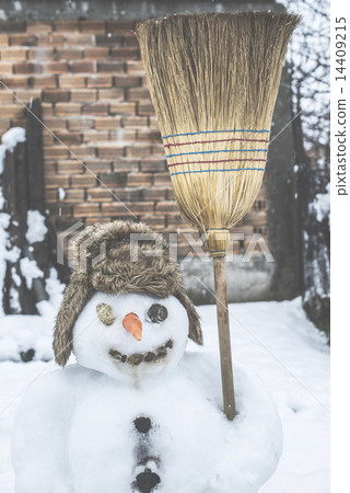 Snowman in the yard 14409215