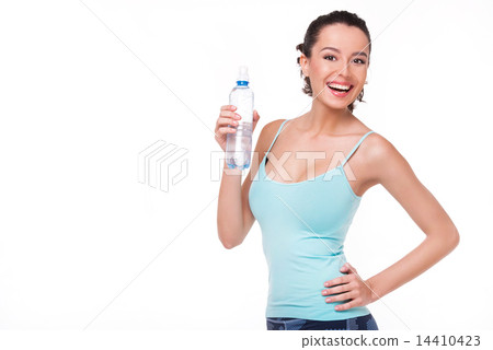 Cheerful sporty woman with a bottle of water Cheerful sporty woman with a bottle of water 14410423