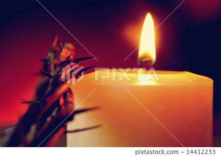 crown of thorns of Jesus Christ and a lit candle 14412233