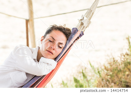 Woman sleeping on hammock Woman sleeping on hammock 14414754