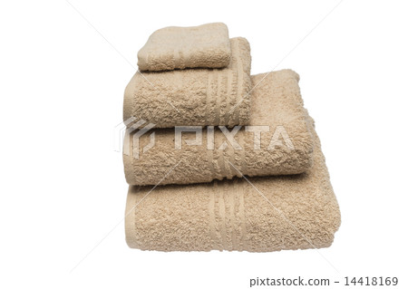 Folded brown bath towels islated in studio on white background 14418169