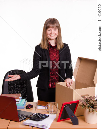Girl in the office gets a new workplace 14419060