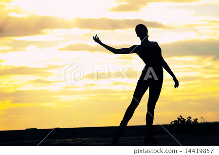 Silhouette of dancing woman over sunset. Yoga 14419857