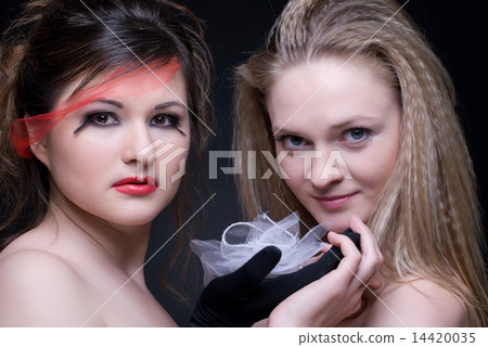 Closeup portrait of two girls: good & evil Closeup portrait of two girls: good & evil 14420035
