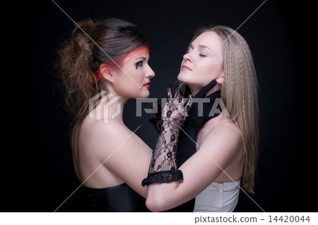 Closeup portrait of two girls: good & evil Closeup portrait of two girls: good & evil 14420044