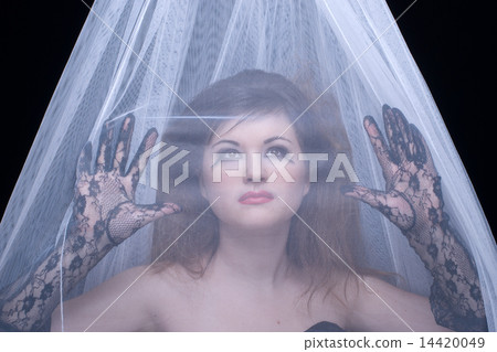 Closeup portrait of beautiful girl in white fabric on black Closeup portrait of beautiful girl in white fabric on black 14420049