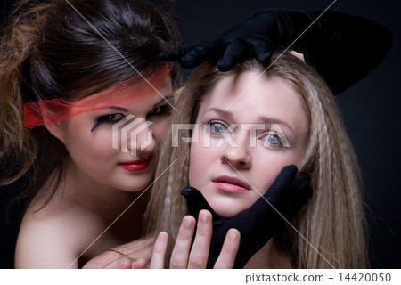 Closeup portrait of two girls: good & evil Closeup portrait of two girls: good & evil 14420050