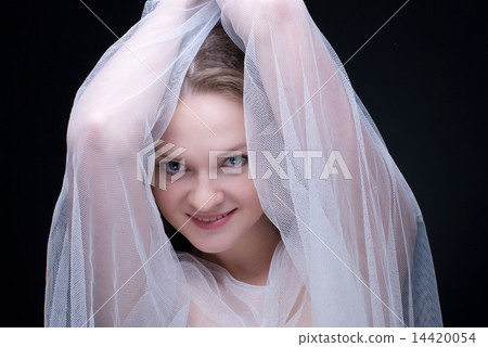 Closeup portrait of beautiful blond girl in white fabric Closeup portrait of beautiful blond girl in white fabric 14420054