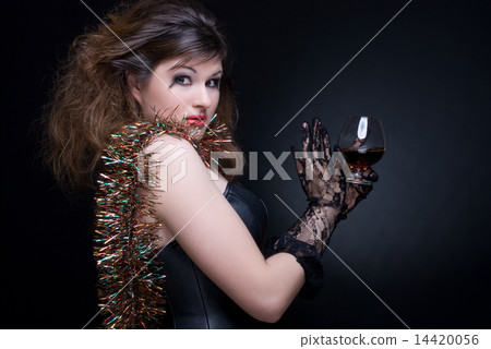 Closeup portrait of girl with red lips, tinsel and wineglass on Closeup portrait of girl with red lips, tinsel and wineglass on 14420056