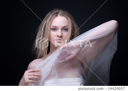 Closeup portrait of beautiful blond girl in white fabric Closeup portrait of beautiful blond girl in white fabric 14420057