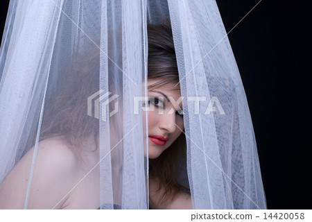 Closeup portrait of beautiful girl in white fabric on black Closeup portrait of beautiful girl in white fabric on black 14420058