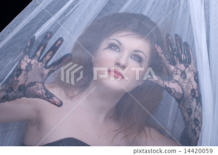 Closeup portrait of beautiful girl in white fabric on black Closeup portrait of beautiful girl in white fabric on black 14420059