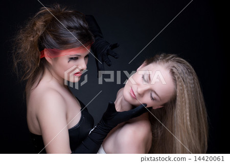 Closeup portrait of two girls: good & evil Closeup portrait of two girls: good & evil 14420061