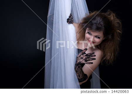 Closeup portrait of beautiful girl in white fabric on black Closeup portrait of beautiful girl in white fabric on black 14420063