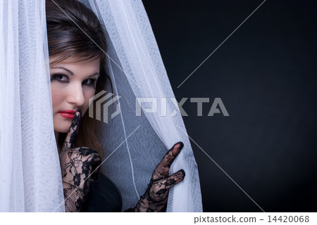 Closeup portrait of beautiful girl in white fabric on black 14420068