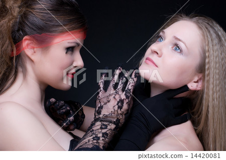 Closeup portrait of two girls: good & evil 14420081