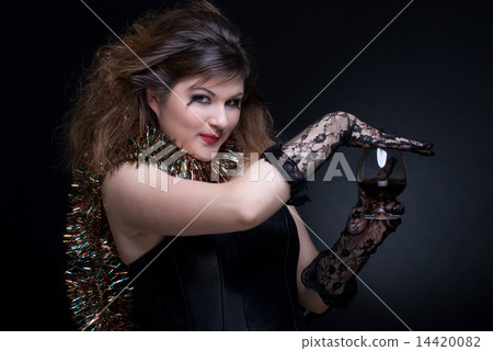 Closeup portrait of girl with red lips, tinsel and wineglass on Closeup portrait of girl with red lips, tinsel and wineglass on 14420082