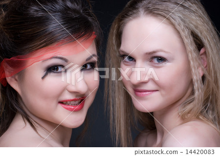 Closeup portrait of two girls: good & evil Closeup portrait of two girls: good & evil 14420083