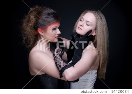 Closeup portrait of two girls: good & evil Closeup portrait of two girls: good & evil 14420084