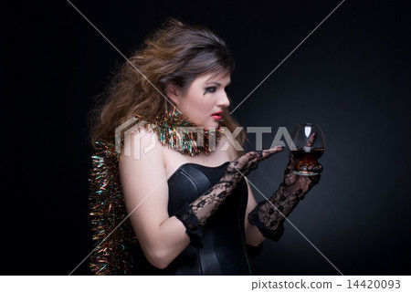 Closeup portrait of girl with red lips, tinsel and wineglass on Closeup portrait of girl with red lips, tinsel and wineglass on 14420093